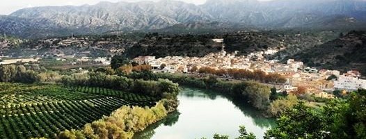 A view of Tivenys nestled on the banks of the river Ebro.