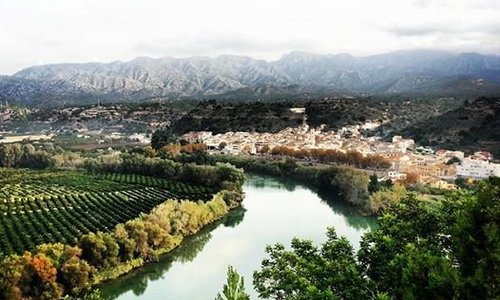 A view of Tivenys nestled on the banks of the river Ebro.