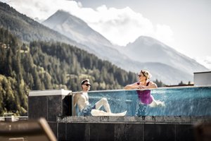 Aktiv- & Wellnesshotel Bergfried in Tux, image may contain: Swimming, Person, Woman, Adult