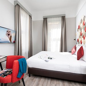 The Three Corners Hotel Art in Budapest, image may contain: Interior Design, Dorm Room, Furniture, Cushion