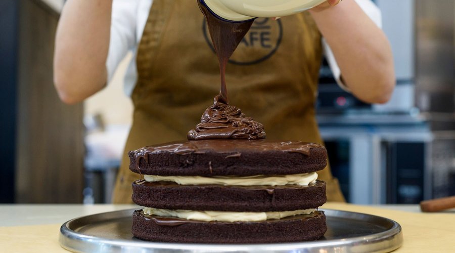 Owner, Sam's famous chocolate cake. Freshly baked on the premises.