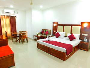 Hotel Sandra Palace in Thekkady, image may contain: Resort, Hotel, Building, Furniture