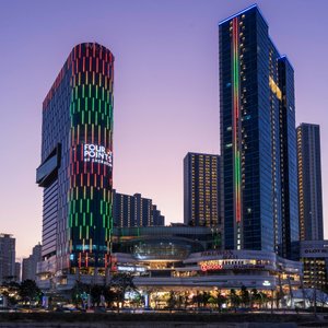 The colorful building of Four Points by Sheraton Surabaya, Pakuwon Indah at dusk 