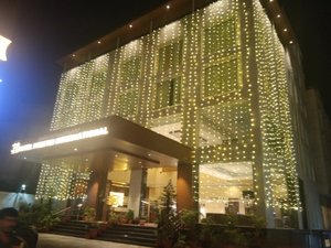 Hotel Preethi International in Mysuru (Mysore), image may contain: Lighting, Hotel, City, Office Building