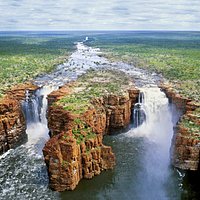The King George Falls is located in one of the worlds most isolated wilderness areas of the Kimberly of Western Australia and is a spiritual place to experience with great cultural significance to the Balanggarra Aboriginal people, for whom the twin falls are the male and female Wunkurr rainbow serpents.
The falls drop about 90 metres into the King George River with large saltwater crocodiles cruising the drop zone.