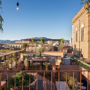 Hotel Calimala in Florence, image may contain: Interior Design, Indoors, Furniture, Chandelier