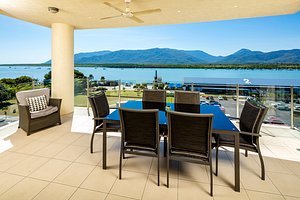 Jack & Newell Holiday Apartments in Cairns, image may contain: Table, Dining Table, Dining Room, Terrace