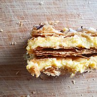 Our signature sweet, the classic vanilla slice! French vanilla custard, freshly baked house made puff pastry, sweet icing and a hint of chocolate.