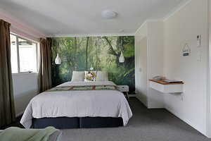 Aden Motel in Te Anau, image may contain: Bed, Furniture, Bedroom, Interior Design
