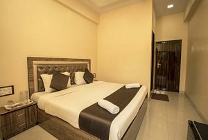 Hotel Apsara in Mumbai, image may contain: Bed, Furniture, Corner, Interior Design