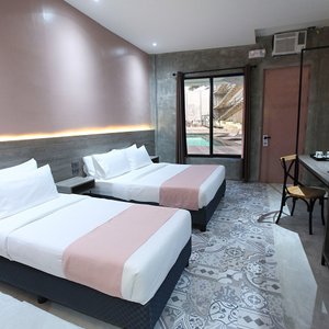The Poolside Queen Deluxe with direct access to the pool.