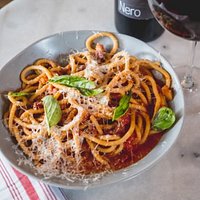 One of our many house-made pastas, paired with one of the full bodied red wines on our menu- bon appetit!
