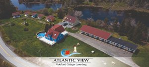 Atlantic View Motel & Cottages in Lunenburg, image may contain: Building, Waterfront, Outdoors, Resort