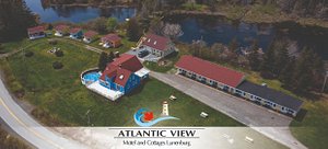 Atlantic View Motel & Cottages in Lunenburg, image may contain: Building, Waterfront, Outdoors, Resort