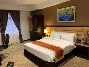 Hallmark Crown Hotel - Melaka in Melaka, image may contain: Furniture, Hotel, Bedroom, Home Decor