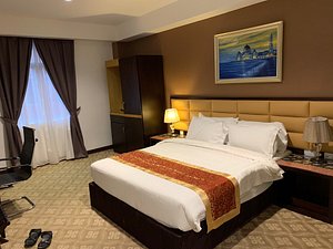 Hallmark Crown Hotel - Melaka in Melaka, image may contain: Furniture, Hotel, Bedroom, Home Decor