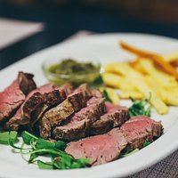 Veal tenderlion tagliata with rocket & Chimichurri sauce