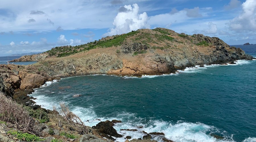 about 30 minutes walk from the parking space just after Flamands Beach, the beach  is really beautiful and you will see some goats on the way