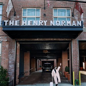 Henry Norman Hotel in Brooklyn, image may contain: Chandelier, Indoors, Floor, Rug