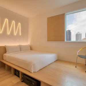 MoMo's Kuala Lumpur in Kuala Lumpur, image may contain: Corner, Chair, Interior Design, Bed