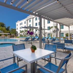Hampton Inn Suites San Juan in Puerto Rico, image may contain: Hotel, Resort, Chair, Dining Table