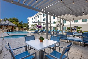 Hampton Inn & Suites San Juan in Puerto Rico, image may contain: Hotel, Resort, Chair, Dining Table