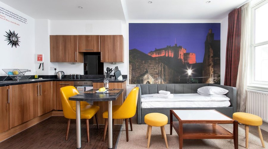 Dining area, Kitchen area and living room area with a sofa bed. 