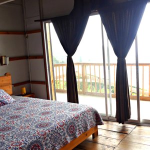The Butterfly Suite at Villa Migelita Ecolodge with private balcony and mountain views