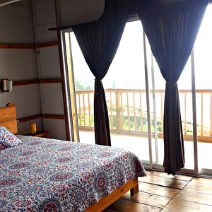 The Butterfly Suite at Villa Migelita Ecolodge with private balcony and mountain views