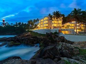 Rockholm in Kovalam, image may contain: Hotel, Resort, Summer, Waterfront