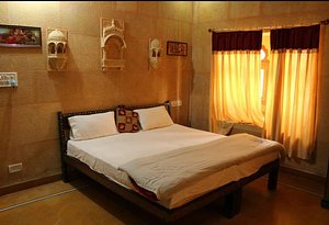 Haveli Hotel in Jaisalmer, image may contain: Bed, Furniture, Hotel, Resort