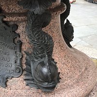 The statue, fountain and information plaque