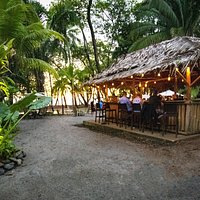 Sea side sittin' either toes in the sand or around our Tiki bar!