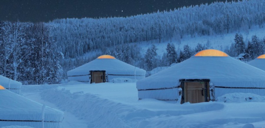Snowy yurts at Arctic Circle
