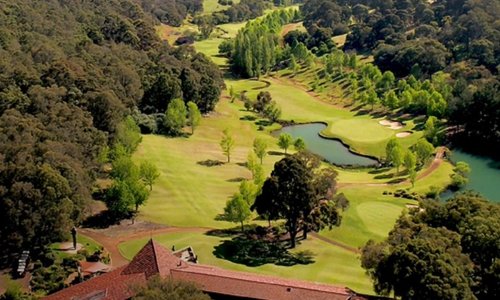Overhead shoot of the course looking at the clubhouse, 18th & 9th holes 