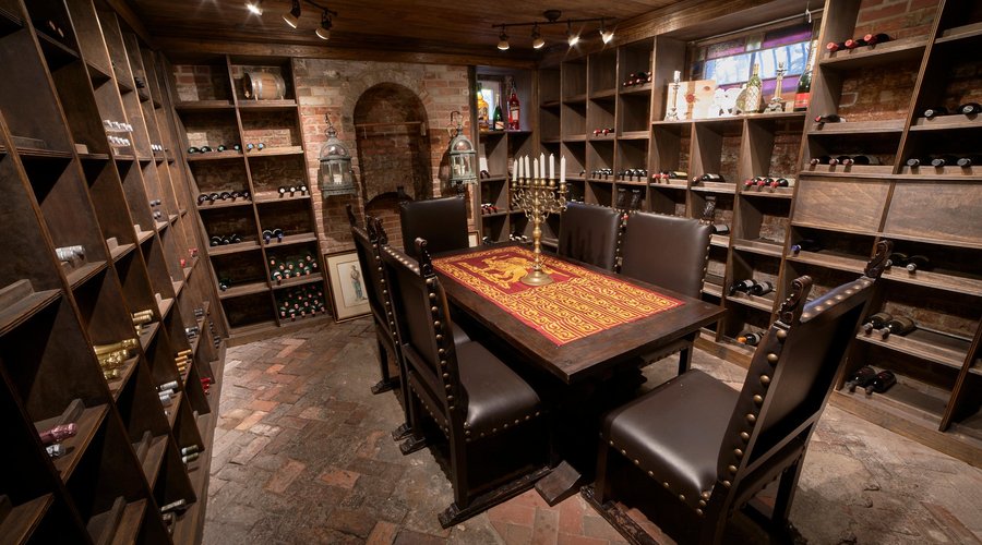 Temperature controlled basement wine cellar with a carefully curated wine selection