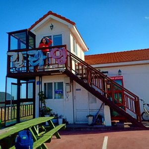 This is Gillime Pension in day and night view. Also the bus stop if you get in bus number 444