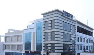 Hotel Tridev in Varanasi, image may contain: Office Building, City, Hotel, Condo