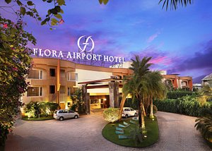 Flora Airport Hotel and Convention Centre in Nedumbassery, image may contain: Hotel, Villa, Resort, Hacienda