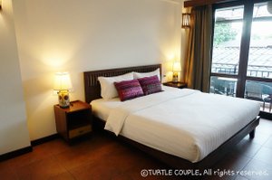 Green Tiger House in Chiang Mai, image may contain: Furniture, Bedroom, Bed, Indoors
