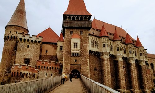 All the elements of a castle the draw gate & bridge, pointed Towers, fortress, rivers at the bottom