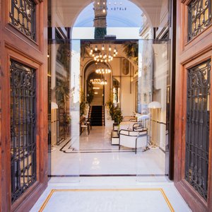 Hotel Palacio Vallier in Valencia, image may contain: Home Decor, Chandelier, Lamp, Indoors