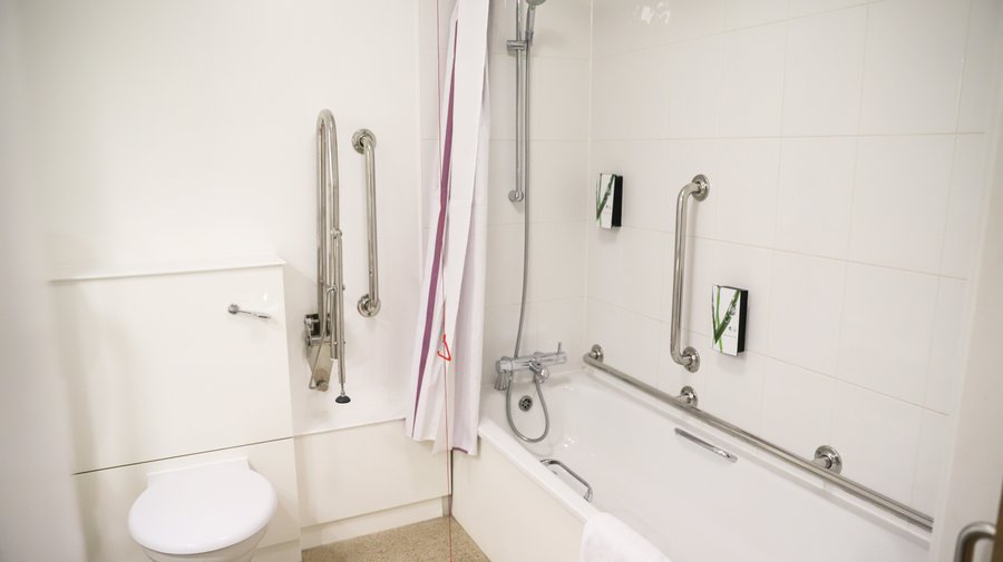 Premier Inn accessible bathroom with lowered bath 
