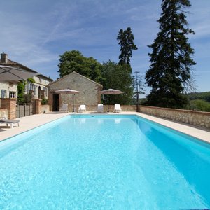 Pool area with countryside views at Le Farat