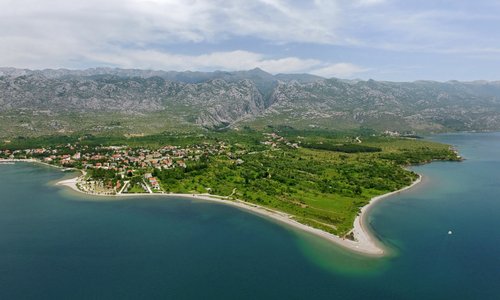 While you are enjoying the crystal clear sea, your glance may come to rest on the magnificent canyons of Velika and Mala Paklenica, deeply cut into the Velebit Mountain above you, and you may not realize that they are responsible for the surprising richness of the natural pebble beaches on the Paklenica Riviera.
