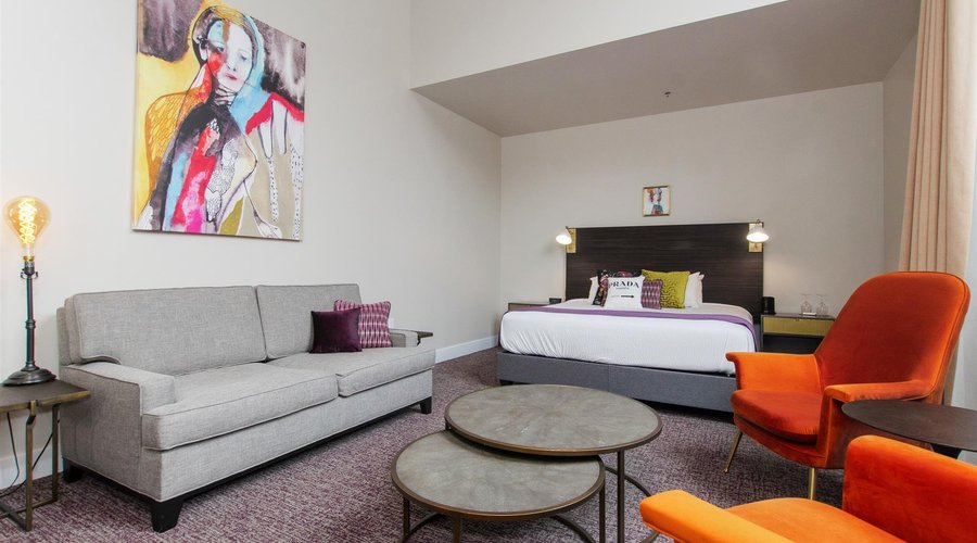 King Suite with Dramatic, High Ceilings and Arched Window
