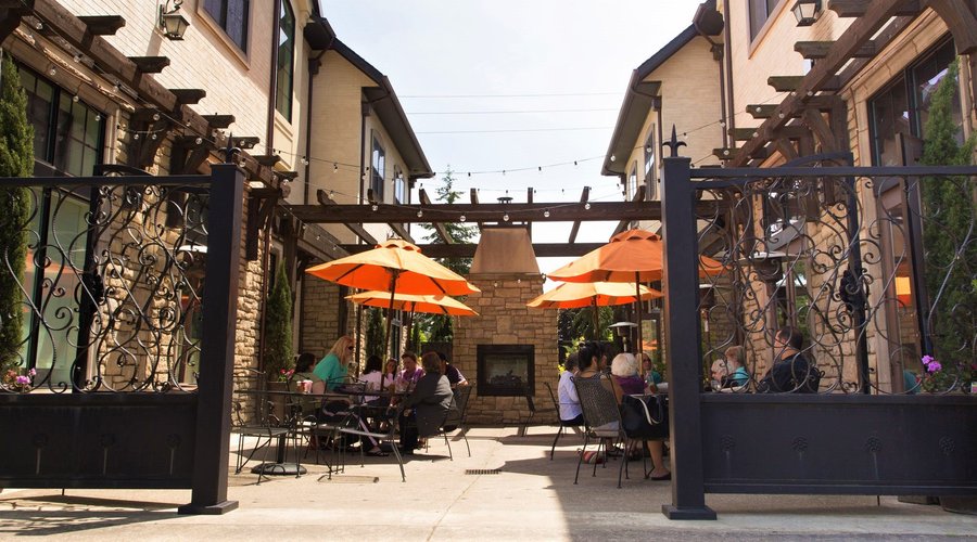 Courtyard with Restaurant Seating and Fireplace
The Inn at Red Hills