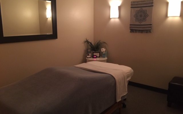 One of our therapy rooms. Sconce lighting reduces to a dim glow during your session.