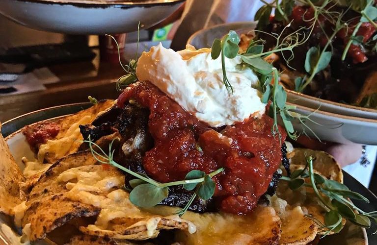 Nachos, choose either spicy beans or pulled pork