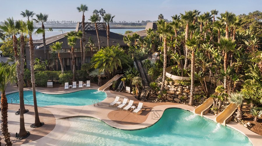 Pool area with 3 pool slides. 